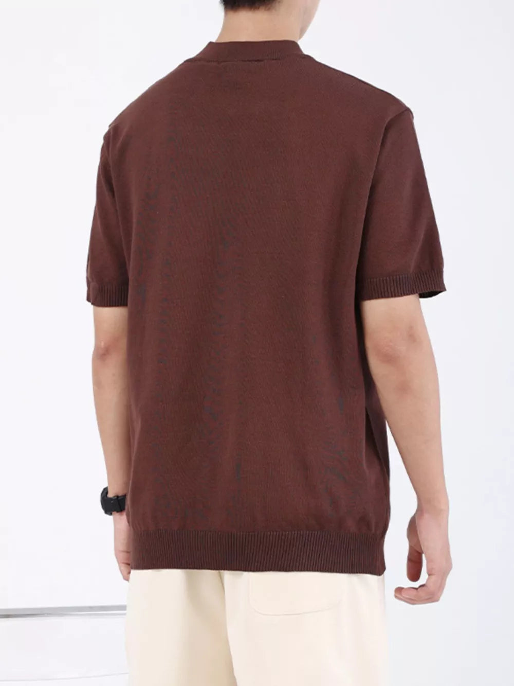 Brown knit t-shirt with mock neck and short sleeves, ribbed hem and cuffs.