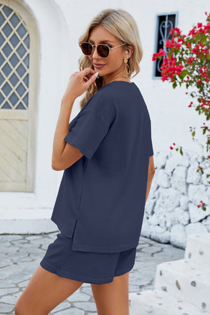 Dark blue waffle knit henley short set with short sleeves and side slits.