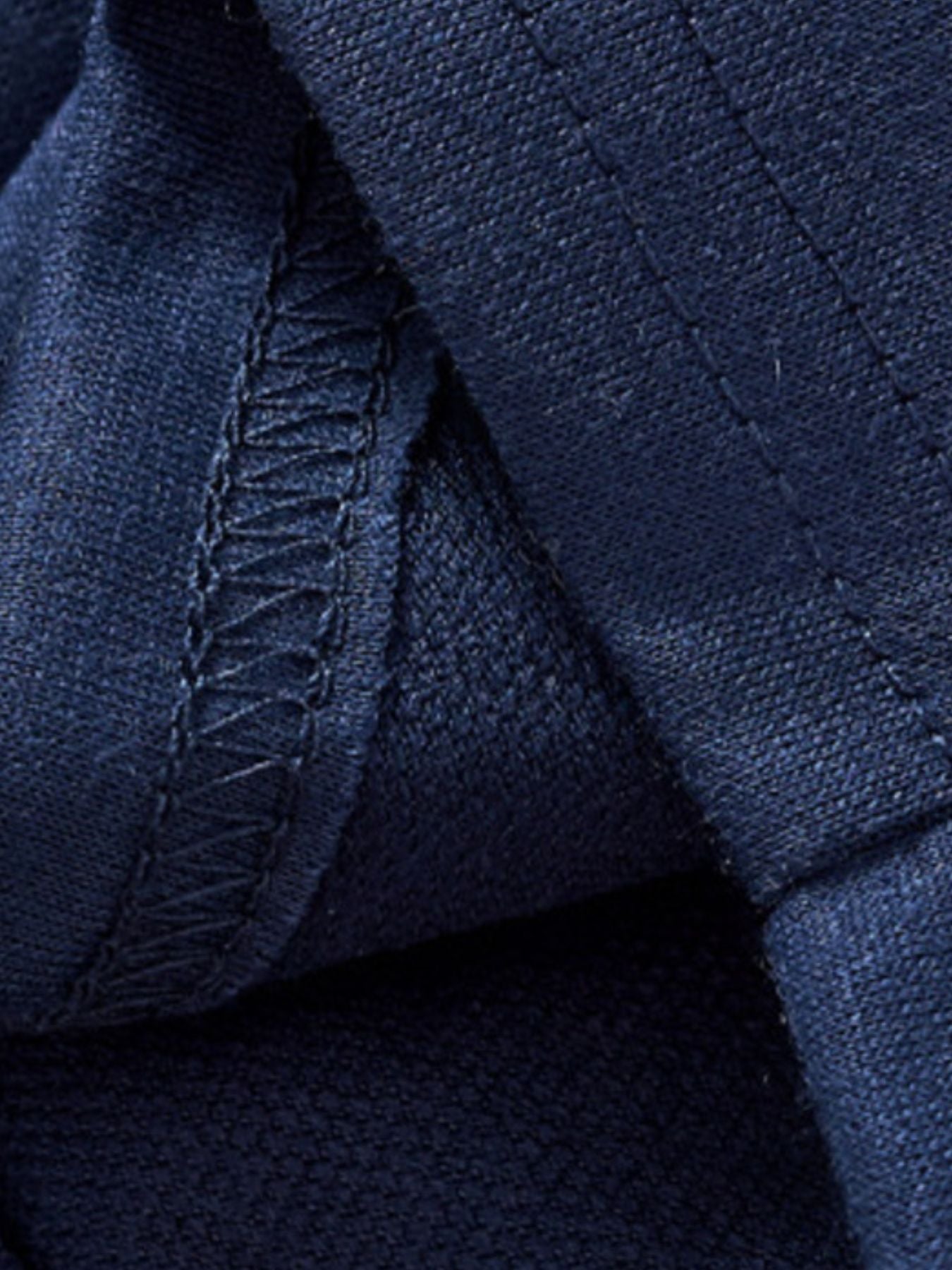 Navy blue toddler tee and shorts set detail showing fabric texture and stitching.