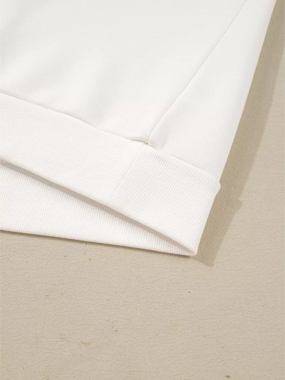 White cotton pullover pajama detail with ribbed hem