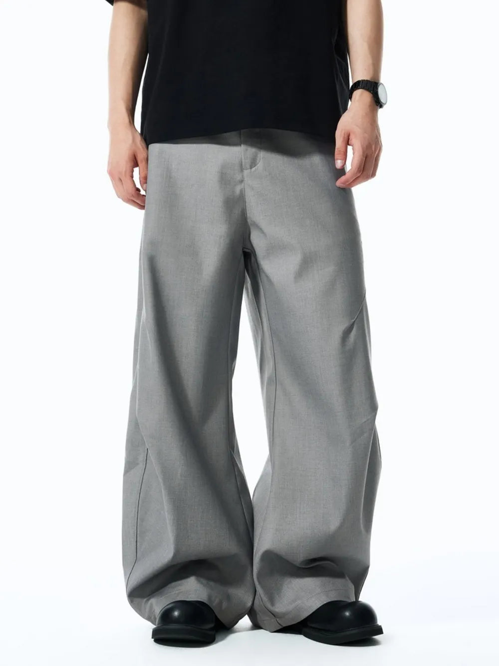 Men's grey relaxed fit oversized sweatpants with a wide leg.