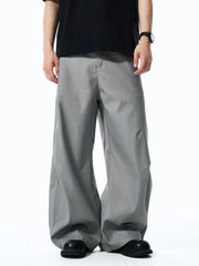 Men's grey relaxed fit oversized sweatpants with a wide leg.