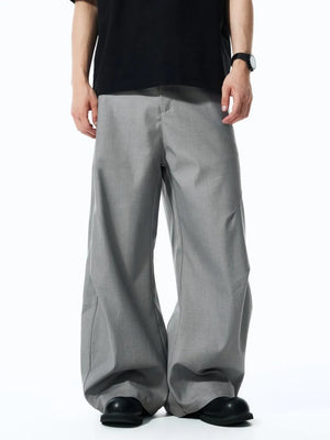 Men's grey relaxed fit oversized sweatpants with a wide leg.