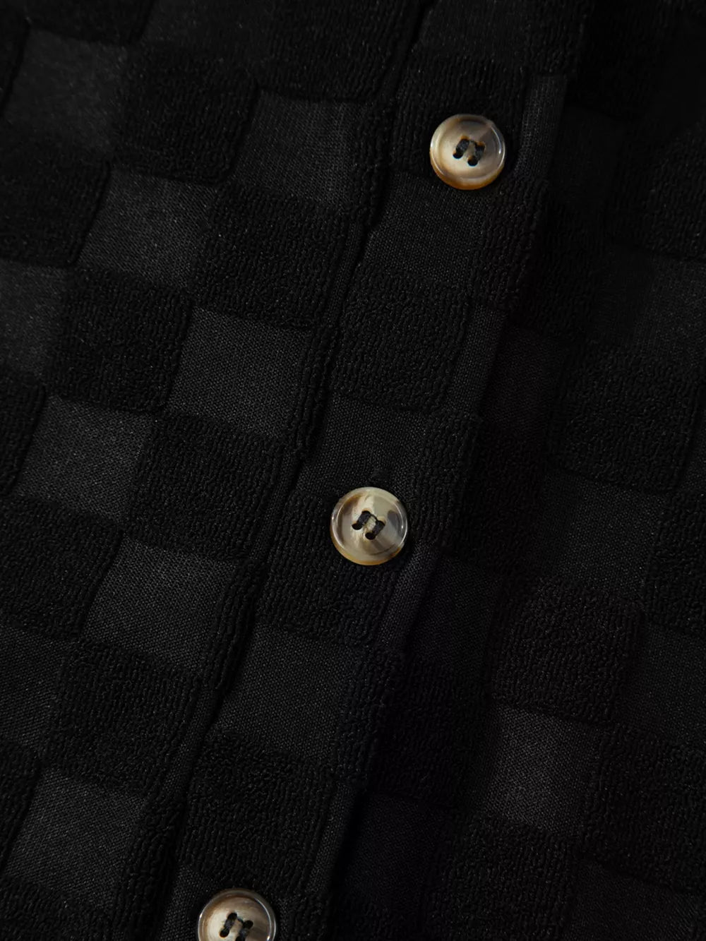Black checkered wide-leg jumpsuit with button-front detail