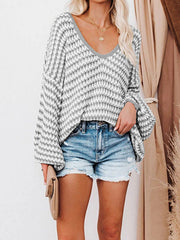 Geometric knit v-neck sweater with bell sleeves in acrylic, grey and white pattern