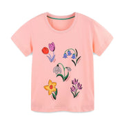 Pink cotton crew neck toddler t-shirt with a whimsical floral print of tulips, bluebells, snowdrops, daffodils, and crocuses.