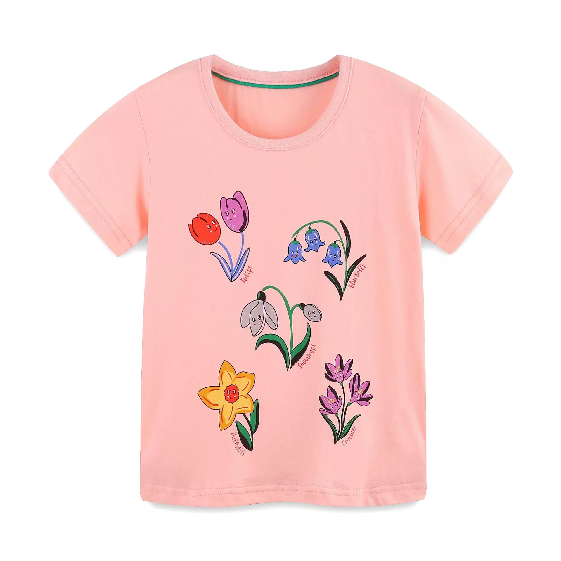 Pink cotton crew neck toddler t-shirt with a whimsical floral print of tulips, bluebells, snowdrops, daffodils, and crocuses.
