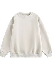 Oversized crew-neck sweatshirt in off-white with ribbed cuffs and hem.