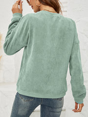 Corduroy sweatshirt in Gum Leaf green with long sleeves and crew neck.