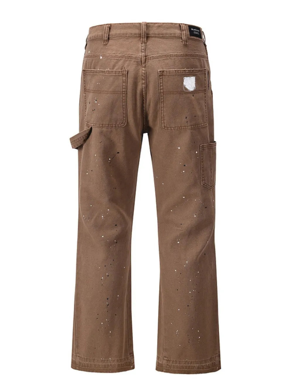 Taupe carpenter trousers with artisan paint splatter detail and utility pocket.