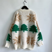 Cream knit sweater with green Christmas trees and tan snowflake appliqué.
