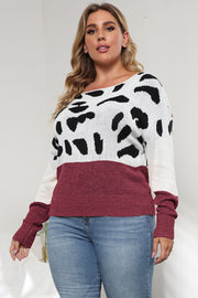 Dalmatian print colorblock knit sweater with wine sleeves and hem.