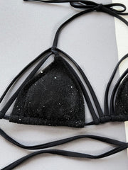 Black strappy bikini top with subtle sparkle detail and tie straps.