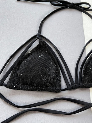 Black strappy bikini top with subtle sparkle detail and tie straps.