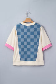 Maternity t-shirt with blue checkered denim panel, cream waffle knit, and pink sleeve trim.