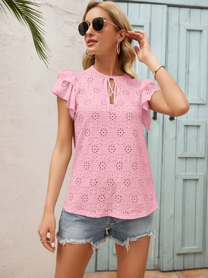 Blush pink eyelet blouse with ruffle sleeves and keyhole tie neckline.
