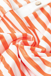 Colorblock stripe sleeveless jumpsuit with a wooden button detail.