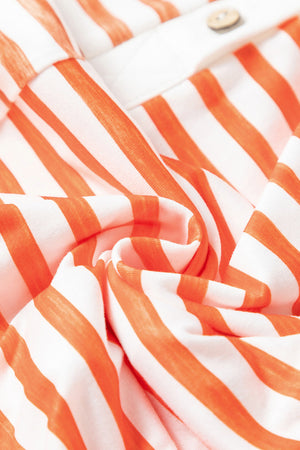 Colorblock stripe sleeveless jumpsuit with a wooden button detail.