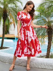 Red floral print midi dress with smocked waist and tiered skirt