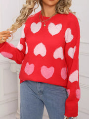 Red fuzzy knit sweater with all-over pink and white hearts, crew neck, long sleeves.