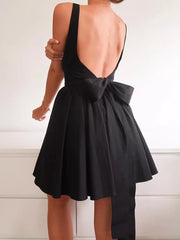 Black backless mini dress with square neck and large bow detail on back