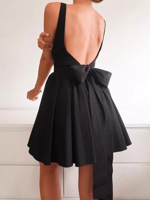 Black backless mini dress with square neck and large bow detail on back