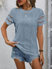 Light Blue scalloped eyelet blouse with short sleeves and intricate patterned fabric.