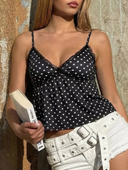 Black polka dot cami with lace trim and V-neckline.