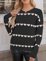 Black knit sweater with white heart stripes, crew neck, long sleeves.
