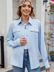 Light blue utility crepe shirt with button-flap chest pockets and roll-tab sleeves.