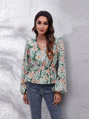 Floral peplum blouse with gathered waist and v-neck