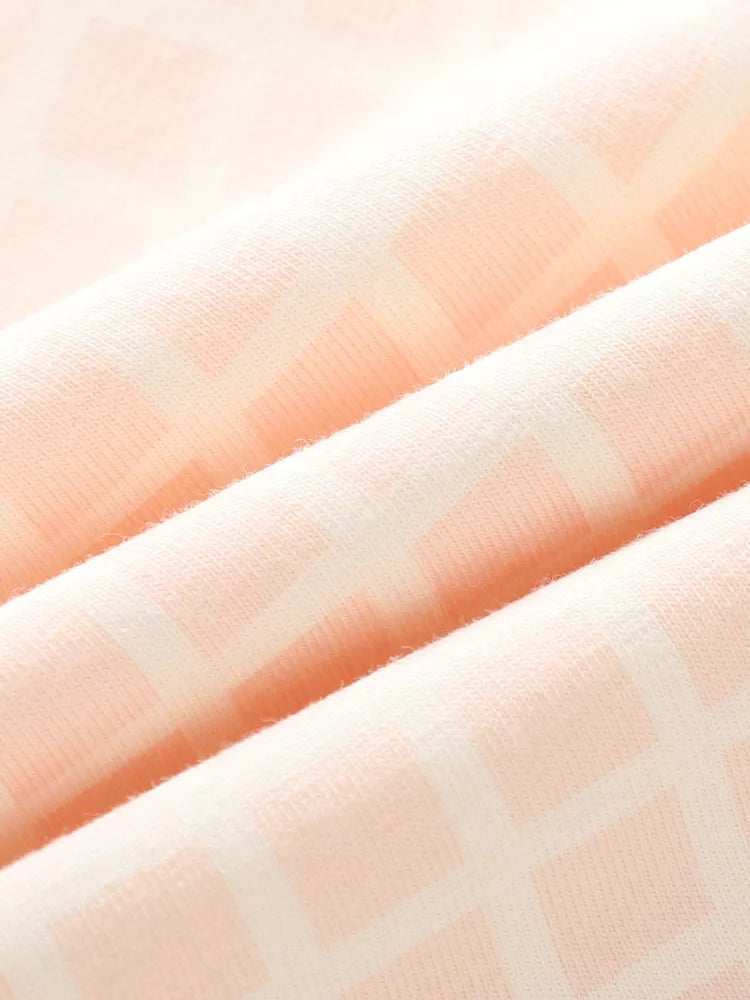 Charming Striped Peplum Set for kids in soft cotton with a subtle geometric pattern.