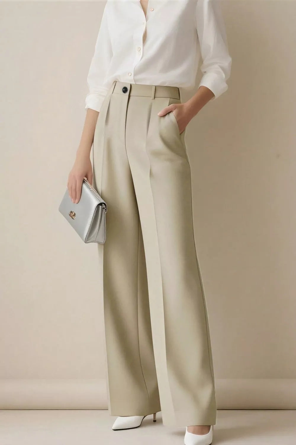 Beige high-waisted wide-leg trousers with a single button closure and front pleats.