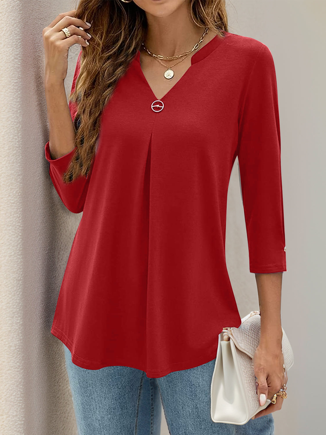 Deep Red pleated V-neck three-quarter sleeve top with decorative button detail.