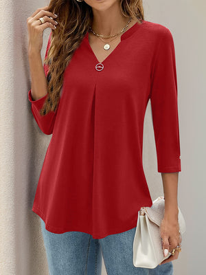 Deep Red pleated V-neck three-quarter sleeve top with decorative button detail.