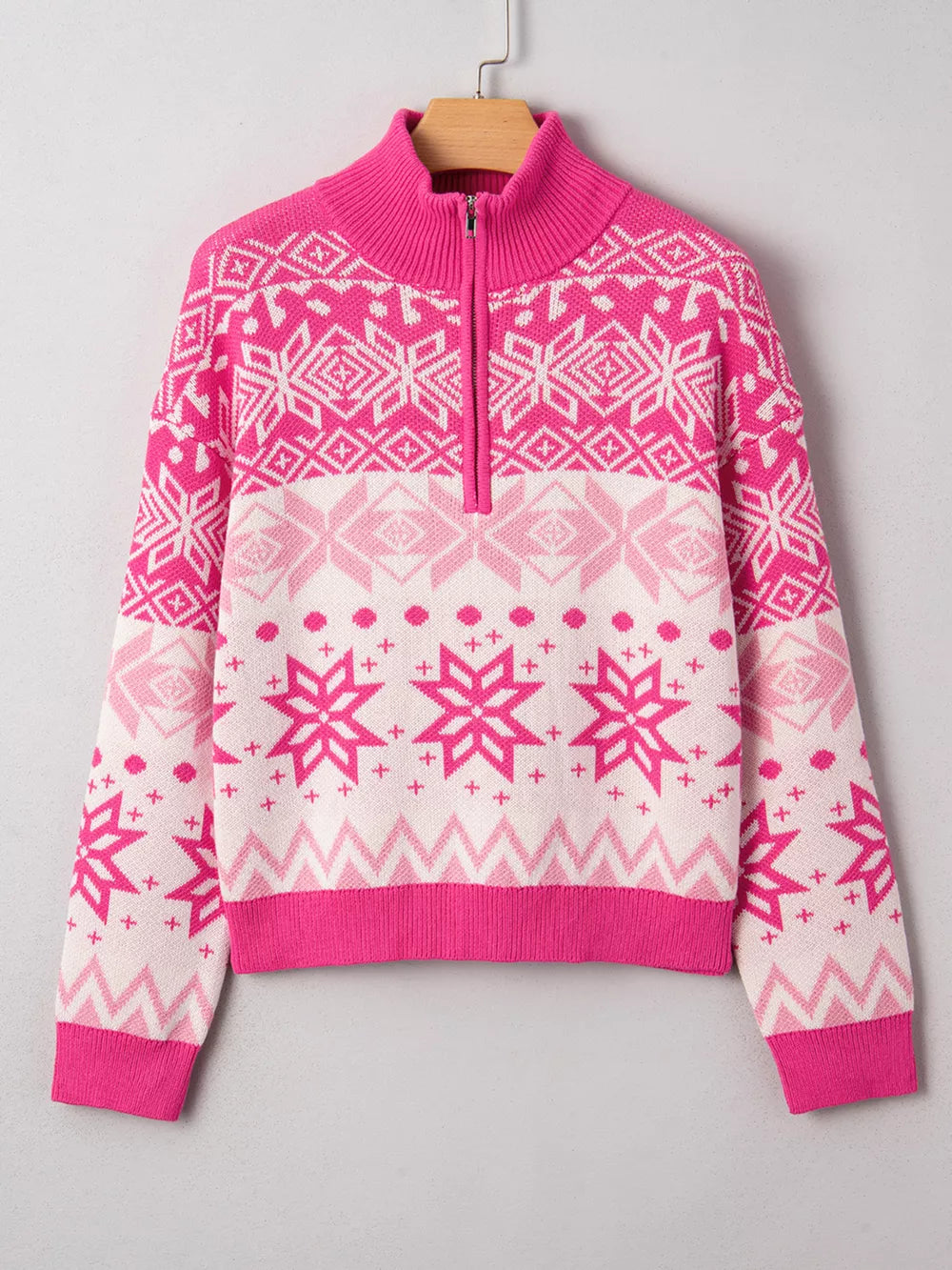 Festive Fair Isle quarter zip knit top in pink and white with snowflake pattern.