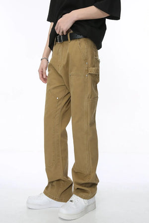 Khaki wide leg carpenter pants with utility pockets and contrast stitching.