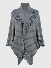 Charcoal striped knit capelet with fringe detail and shawl collar.