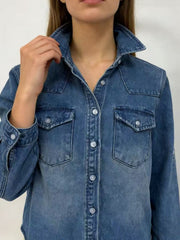 Classic blue denim overshirt with button-down front and chest pockets.