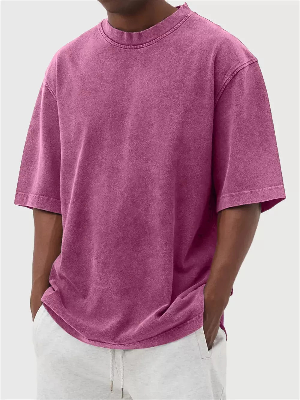 Men's purple vintage wash oversized crew neck t-shirt with raw hem detail.