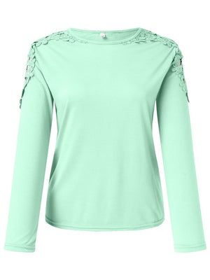 Light green long sleeve top with lace yoke and sleeve detail