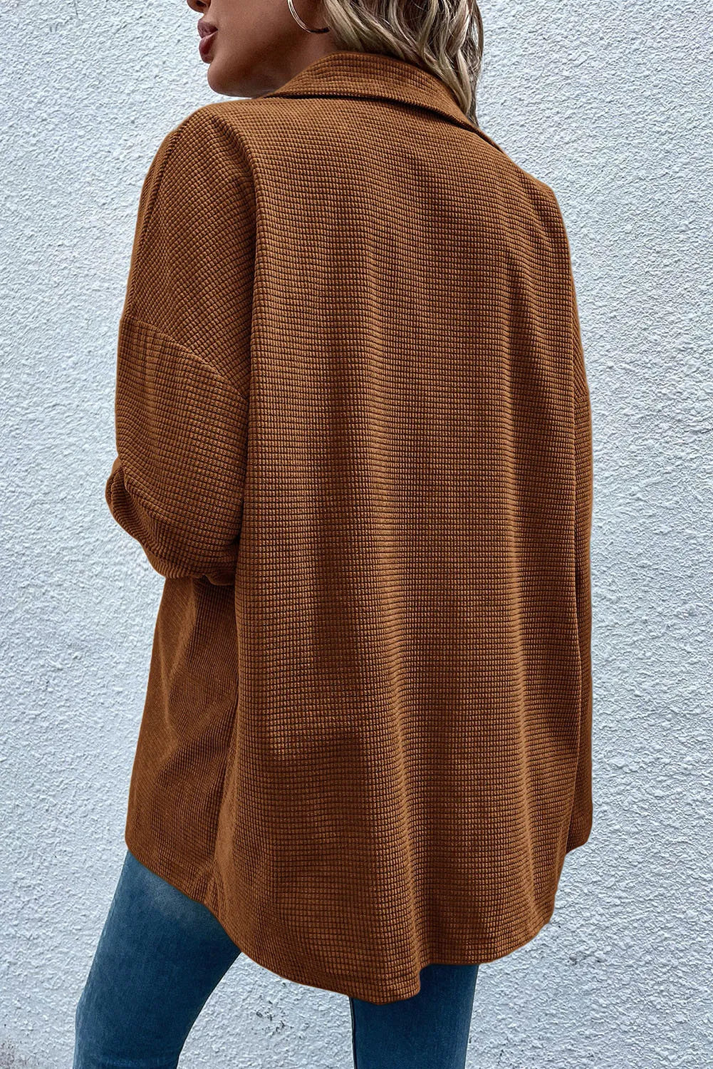 Brown waffle knit overshirt with patch pockets and button-down front.