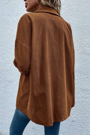 Brown waffle knit overshirt with patch pockets and button-down front.