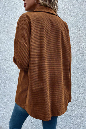 Brown waffle knit overshirt with patch pockets and button-down front.