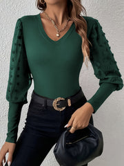 Dark green ribbed bodysuit with sheer pom-pom detail sleeves and V-neck