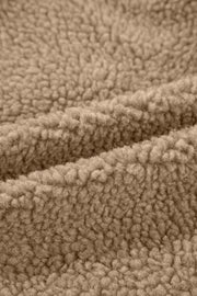 Sherpa-lined hooded jacket in brown, showing fuzzy texture detail.