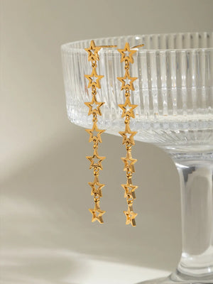 Gold celestial star dangle earrings with multiple stars on chains