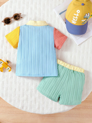 Baby color block set with blue, yellow, and coral shirt and mint green shorts.