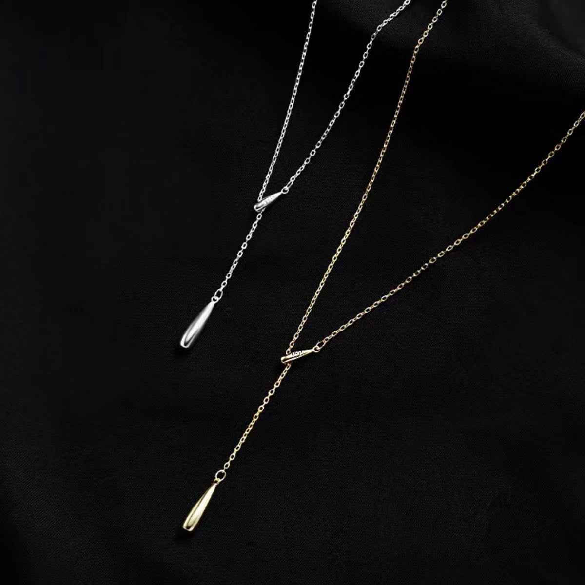 Sterling silver and gold Y-shaped pendant necklaces with teardrop drops.
