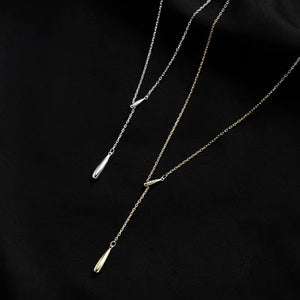 Sterling silver and gold Y-shaped pendant necklaces with teardrop drops.